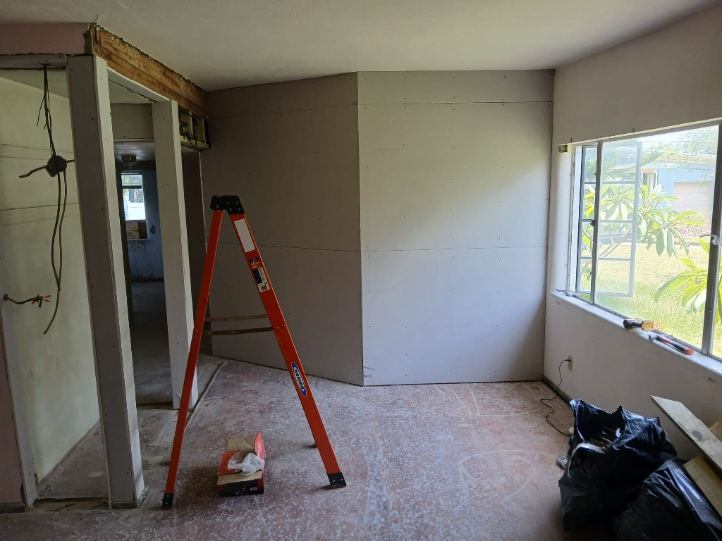 Damaged drywall before repair